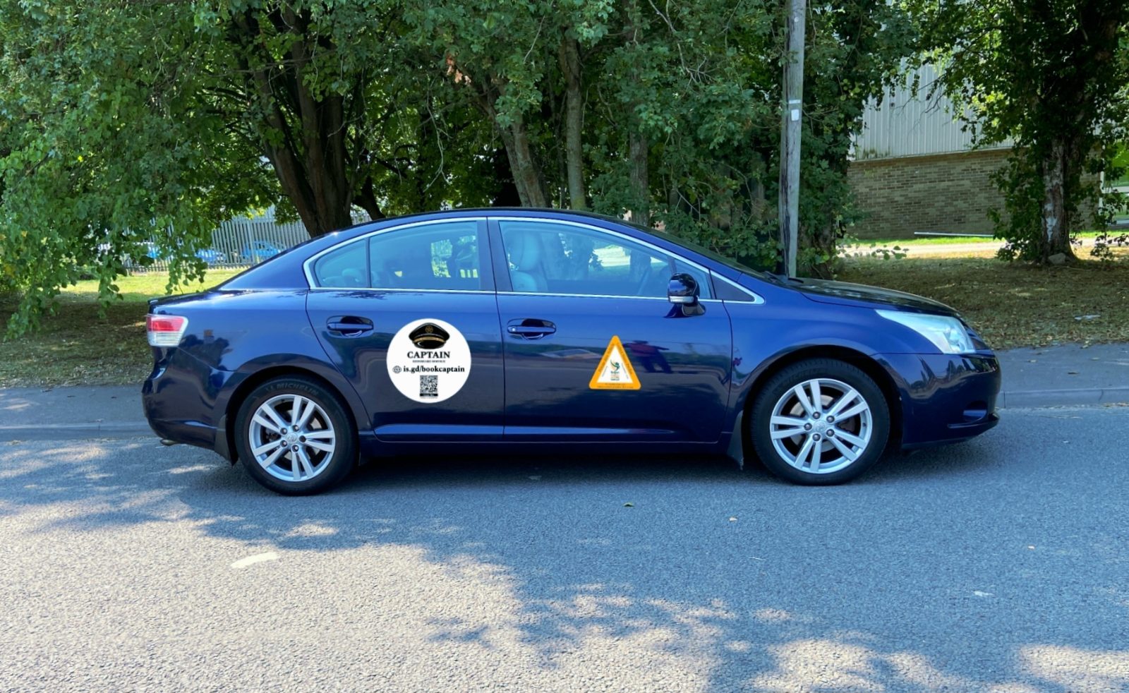 Two of spotless people carriers, ribboned up and ready for a wedding