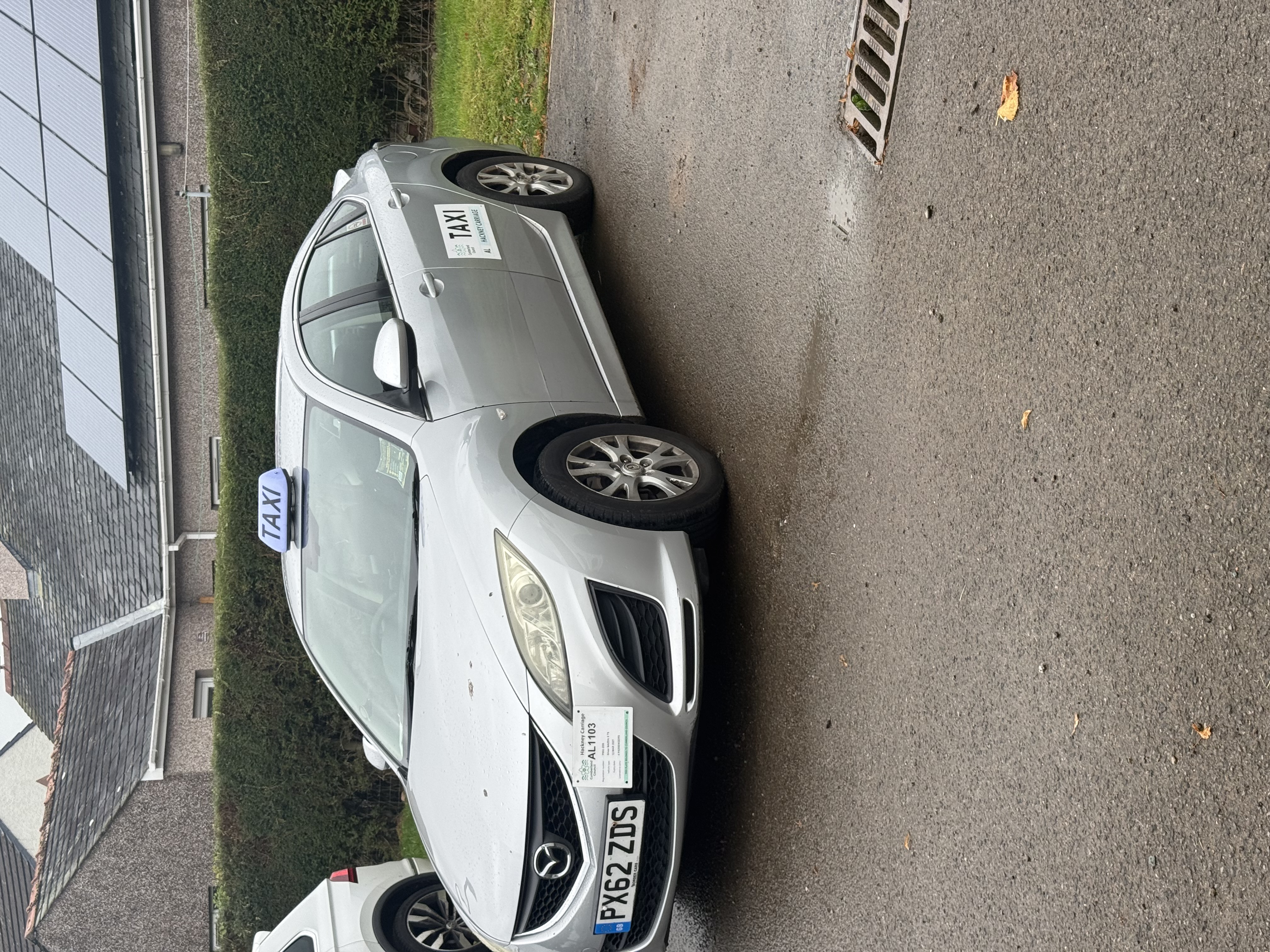 Two of spotless people carriers, ribboned up and ready for a wedding